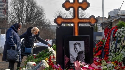Russian opposition leader Alexei Navalny's mother, Lyudmila Navalnaya, left, and his mother-in-law Alla Abrosimova visit the grave of Alexei Navalny after his yesterday funeral at the Borisovskoye Cemetery, in Moscow, Russia, on Saturday, March 2, 2024. Navalny, who was President Vladimir Putin's fiercest foe, was buried after a funeral that drew thousands of mourners amid a heavy police presence. (AP)