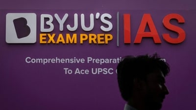 A man walks past an advertising hoarding of Byju's, an Education Technology company and one of India's biggest startup, outside one of its branches in New Delhi. (REUTERS)