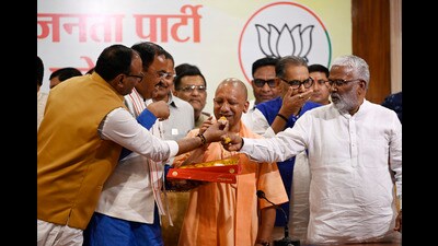 Deputy Chief minister Keshav Prasad Maurya and Brajesh Pathak and cabinet minister Swatantra Dev Singh exchanging sweets with CM Yogi Adityanath at BJP party office (HT File) Deputy Chief minister Keshav Prasad Maurya and Brajesh Pathak and cabinet minister Swatantra Dev Singh exchanging sweets with CM Yogi Adityanath at BJP party office (HT File)