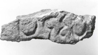 A fragment of a stone relief from the Sasanian empire bearing a Pahlavi inscription using Middle Persian script. This piece is currently at the Metropolitan Museum of Art (Wikimedia Commons)
