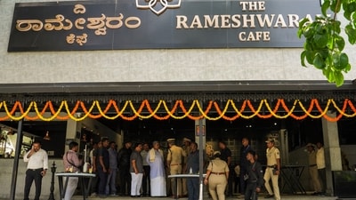 Security personnel stand guard at the Rameshwaram cafe blast site, in Bengaluru. (PTI) (HT_PRINT) Security personnel stand guard at the Rameshwaram cafe blast site, in Bengaluru. (PTI) (HT_PRINT)