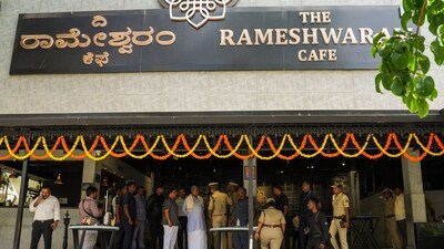Security personnel stand guard at the Rameshwaram cafe blast site, in Bengaluru. (PTI) Security personnel stand guard at the Rameshwaram cafe blast site, in Bengaluru. (PTI)