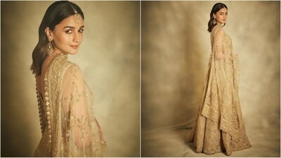 Alia's glamorous outfit features a deep v-neck blouse adorned with intricate gold embroidery all over. She paired it with a heavily embroidered lehenga skirt, which is embellished with gold sequin resham hand embroidery all over showcasing rich craftsmanship. She completed the look with an elegant matching dupatta. (Instagram/@aliaabhatt) Alia's glamorous outfit features a deep v-neck blouse adorned with intricate gold embroidery all over. She paired it with a heavily embroidered lehenga skirt, which is embellished with gold sequin resham hand embroidery all over showcasing rich craftsmanship. She completed the look with an elegant matching dupatta. (Instagram/@aliaabhatt)