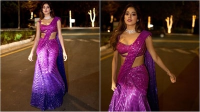 In the next look, she effortlessly draped herself in a six-yards of grace. Her stunning sequined saree featured a captivating ombre pattern in dual shades of pink and purple. She paired it with a plunging neckline blouse and a luxurious diamond choker adorning her neck. (Instagram/@janhvikapoor)