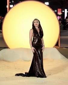Florence Pugh in a Valentino brown sequin dress with a hood (Instagram) Florence Pugh in a Valentino brown sequin dress with a hood (Instagram)