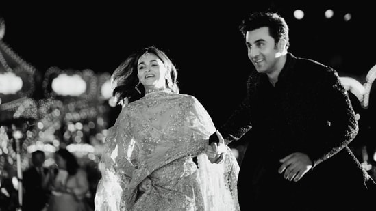 Alia Bhatt wore a golden lehenga and V-neck choli. She accessorised with maang tika and earrings. Ranbir Kapoor was seen in a navy blue and silver sherwani. Alia posted their photos from the event on Instagram. In a black-and-white picture, the duo was seen running.