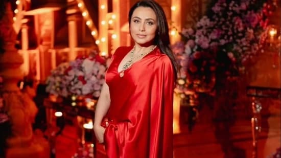 Rani Mukerji opted for a red satin saree and matching blouse as she posed for pictures.&nbsp;