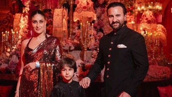 Kareena Kapoor looked ethereal in a red-golden-hued shimmery saree that she paired with a matching halter-neck blouse. She accessorised her look with dangling earrings and tied her hair in a sleek top bun. Saif Ali Khan and Taimur Ali Khan twinned in a black and white sherwani look.