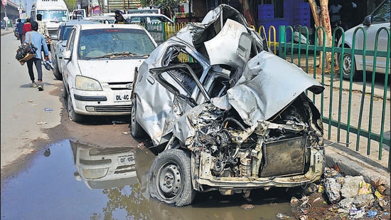 The mangled remains of the car at the Badarpur police station on Sunday. (Vipin Kumar/HT photo)