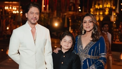 Actor Shah Rukh Khan opted for an off-white sherwani and salwar with little embroidery at the bottom. Gauri Khan wore a heavily embellished blue sharara set and their son AbRam Khan looked cute in a black sherwani. Actor Shah Rukh Khan opted for an off-white sherwani and salwar with little embroidery at the bottom. Gauri Khan wore a heavily embellished blue sharara set and their son AbRam Khan looked cute in a black sherwani.
