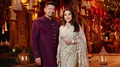 Madhuri Dixit wore an embroidered saree and matching blouse. Her husband Dr Shriram Nene opted for a purple sherwani and white pants. Madhuri Dixit wore an embroidered saree and matching blouse. Her husband Dr Shriram Nene opted for a purple sherwani and white pants.