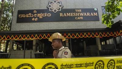 A police official stands guard at the Rameshwaram cafe blast site in Bengaluru on Saturday. (PTI) A police official stands guard at the Rameshwaram cafe blast site in Bengaluru on Saturday. (PTI)