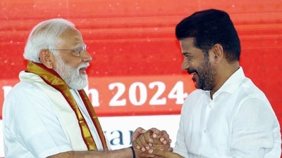 Prime Minister Narendra Modi being greeted by Telangana CM Revanth Reddy at the inauguration of multiple development projects in Adilabad on Monday. (ANI)