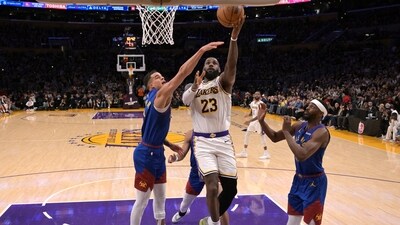 Los Angeles Lakers forward LeBron James (23) drives past Denver Nuggets forward Michael Porter Jr. (1) to score his 40,000th career point. (USA TODAY Sports via Reuters Con)