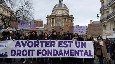 Women take part in a rally to call for the constitutionalisation of the right to abortion outside the Senate in Paris (AFP) Women take part in a rally to call for the constitutionalisation of the right to abortion outside the Senate in Paris (AFP)