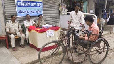 Police personnel interact with villagers at Sandeshkhali in North 24 Parganas district on February 25. (PTI) Police personnel interact with villagers at Sandeshkhali in North 24 Parganas district on February 25. (PTI)