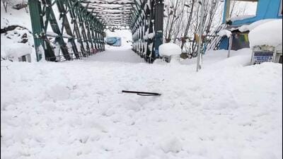 The Tandi bridge blocked due to heavy snowfall in Lahaul valley on Sunday. (HT Photo) The Tandi bridge blocked due to heavy snowfall in Lahaul valley on Sunday. (HT Photo)
