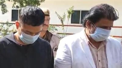 Two of the three suspects in police custody on Monday. The suspects were arrested from near Gaur City township in Greater Noida West on Monday, based on a tip-off, said police. (HT Photo) Two of the three suspects in police custody on Monday. The suspects were arrested from near Gaur City township in Greater Noida West on Monday, based on a tip-off, said police. (HT Photo)