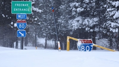 TRUCKEE, CALIFORNIA - MARCH 03: An Interstate 80 (I-80) entrance is covered in snow during a powerful multiple day winter storm in the Sierra Nevada mountains on March 03, 2024 in Truckee, California. A stretch of Interstate 80 in California remains shut down in both directions due to the storm. Blizzard warnings were issued with snowfall of up to 12 feet expected in some higher elevation locations. Mario Tama/Getty Images/AFP (Photo by MARIO TAMA / GETTY IMAGES NORTH AMERICA / Getty Images via AFP) (Getty Images via AFP) TRUCKEE, CALIFORNIA - MARCH 03: An Interstate 80 (I-80) entrance is covered in snow during a powerful multiple day winter storm in the Sierra Nevada mountains on March 03, 2024 in Truckee, California. A stretch of Interstate 80 in California remains shut down in both directions due to the storm. Blizzard warnings were issued with snowfall of up to 12 feet expected in some higher elevation locations. Mario Tama/Getty Images/AFP (Photo by MARIO TAMA / GETTY IMAGES NORTH AMERICA / Getty Images via AFP) (Getty Images via AFP)
