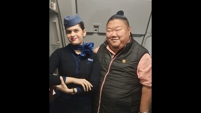 Nagaland minister Temjen Imna Along posing for the camera with an IndiGo cabin crew member. (X/@AlongImna) Nagaland minister Temjen Imna Along posing for the camera with an IndiGo cabin crew member. (X/@AlongImna)