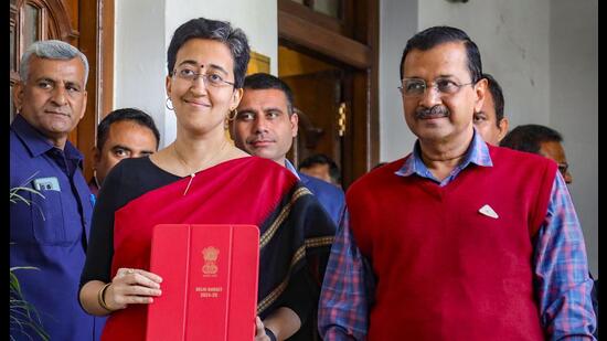 Finance minister Atishi with chief minister Arvind Kejriwal ahead of the budget presentation. (PTI)