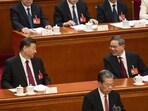 Xi Jinping, China's president, left, speaks with Li Qiang, China's premier, right, during the opening of the Second Session of the 14th National People's Congress (NPC) at the Great Hall of the People in Beijing, China. Xi Jinping, China's president, left, speaks with Li Qiang, China's premier, right, during the opening of the Second Session of the 14th National People's Congress (NPC) at the Great Hall of the People in Beijing, China.