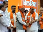 Gujarat BJP chief CR Paatil was seen welcoming Arjun Modhwadia and Congress's former working president Ambarish Der, with BJP scarfs and caps on Tuesday. Gujarat BJP chief CR Paatil was seen welcoming Arjun Modhwadia and Congress's former working president Ambarish Der, with BJP scarfs and caps on Tuesday.
