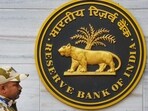 A security official walks past an emblem of the Reserve Bank of India at the RBI headquarters, in Mumbai (PTI FILE) A security official walks past an emblem of the Reserve Bank of India at the RBI headquarters, in Mumbai (PTI FILE)