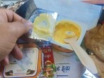 The image shows spoilt yogurt served on Vande Bharat Express. 