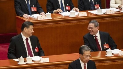 Xi Jinping, China's president, left, speaks with Li Qiang, China's premier, right, during the opening of the Second Session of the 14th National People's Congress (NPC) at the Great Hall of the People in Beijing, China. (Bloomberg) Xi Jinping, China's president, left, speaks with Li Qiang, China's premier, right, during the opening of the Second Session of the 14th National People's Congress (NPC) at the Great Hall of the People in Beijing, China. (Bloomberg)