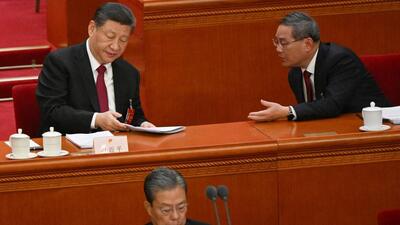 China's President Xi Jinping (left) speaks with Premier Li Qiang during the opening session of the National People's Congress (NPC) at the Great Hall of the People in Beijing on Tuesday. (AFP) China's President Xi Jinping (left) speaks with Premier Li Qiang during the opening session of the National People's Congress (NPC) at the Great Hall of the People in Beijing on Tuesday. (AFP)