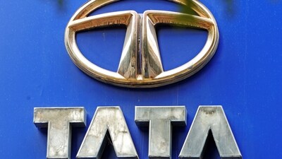 Tata Motors Share Price: A Tata Motors logo installed at one of its showroom is pictured in Mumbai. (AFP) Tata Motors Share Price: A Tata Motors logo installed at one of its showroom is pictured in Mumbai. (AFP)
