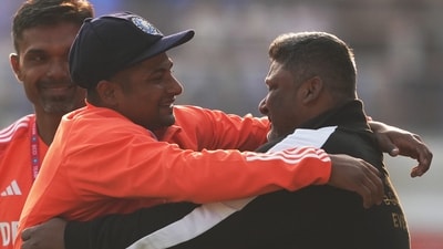 India's Sarfaraz Khan hugs his father Naushad Khan after receiving his debut Test cap (PTI) India's Sarfaraz Khan hugs his father Naushad Khan after receiving his debut Test cap (PTI)
