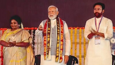 PM Narendra Modi with Tenalgana Governor Tamilisai Soundararajan and Union Minister G Kishan Reddy during inauguration and foundation stone laying of multiple developmental projects in Sangareddy. (PTI)
