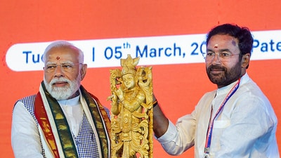 PM Narendra Modi being felicitated by Union Minister G Kishan Reddy during foundation stone laying and inauguration of various projects in Sangareddy. (PTI)