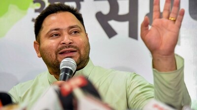Patna: Former Bihar Deputy CM and RJD MLA Tejashwi Yadav addresses a press conference at his residence. (PTI)