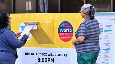 TOPSHOT - Women drop off their ballots into a ballot box on March 4, 2024 at the Los Angeles County Registrar in Norwalk, California ahead of the Primary election on "Super Tuesday," March 5. (AFP) TOPSHOT - Women drop off their ballots into a ballot box on March 4, 2024 at the Los Angeles County Registrar in Norwalk, California ahead of the Primary election on "Super Tuesday," March 5. (AFP)