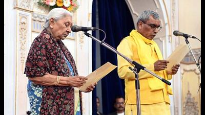 UP governor Anandiben Patel administers the oath of office to Suheldev Bharatiya Samaj Party (SBSP) chief Om Prakash Rajbhar as the state cabinet minister during the swearing-in ceremony, at the Governor’s House, in Lucknow on Tuesday. (ANI Photo) UP governor Anandiben Patel administers the oath of office to Suheldev Bharatiya Samaj Party (SBSP) chief Om Prakash Rajbhar as the state cabinet minister during the swearing-in ceremony, at the Governor’s House, in Lucknow on Tuesday. (ANI Photo)