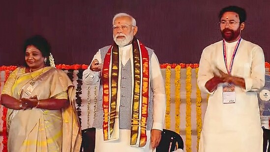 PM Narendra Modi with Tenalgana Governor Tamilisai Soundararajan and Union Minister G Kishan Reddy during inauguration and foundation stone laying of multiple developmental projects in Sangareddy.(PTI)