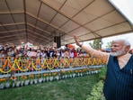 Prime Minister Narendra Modi waves at the gathering during foundation stone laying and inauguration of multiple connectivity projects, in Kolkata on Wednesday, Prime Minister Narendra Modi waves at the gathering during foundation stone laying and inauguration of multiple connectivity projects, in Kolkata on Wednesday,