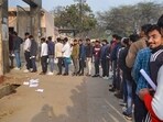 Candidates wait in a queue to appear in the UP Police Constables recruitment exam in Mathura Candidates wait in a queue to appear in the UP Police Constables recruitment exam in Mathura