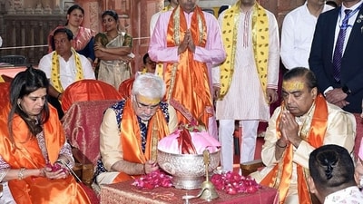 Paparazzi videos show Mukesh Ambani seeking blessings from his mother, accompanied by Radhika's parents, Viren and Shaila Merchant. Paparazzi videos show Mukesh Ambani seeking blessings from his mother, accompanied by Radhika's parents, Viren and Shaila Merchant. 