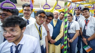 PM Modi poses for a photo with school students as they travel in India's first underwater metro train after the flagging off ceremony in Kolkata. (ANI) PM Modi poses for a photo with school students as they travel in India's first underwater metro train after the flagging off ceremony in Kolkata. (ANI)