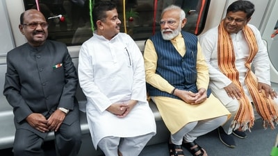 PM Modi interacts with West Bengal LoP Suvendu Adhikari as they travel in India's first underwater metro train after the flagging off ceremony in Kolkata. West Bengal Governor CV Ananda Bose and state BJP President Sukanta Majumdar are also seen in this photo. (ANI) PM Modi interacts with West Bengal LoP Suvendu Adhikari as they travel in India's first underwater metro train after the flagging off ceremony in Kolkata. West Bengal Governor CV Ananda Bose and state BJP President Sukanta Majumdar are also seen in this photo. (ANI)