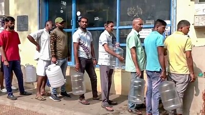 People stand in queues to get drinking water as areas like Whitefield, Mahadevpura and RR Nagar face drinking water shortages, in Bengaluru on Sunday. (ANI) People stand in queues to get drinking water as areas like Whitefield, Mahadevpura and RR Nagar face drinking water shortages, in Bengaluru on Sunday. (ANI)