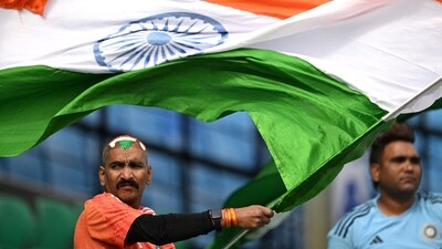Team India's ardent fan Sudhir Kumar Chaudhary, waves the national flag during the practice session (AFP) Team India's ardent fan Sudhir Kumar Chaudhary, waves the national flag during the practice session (AFP)