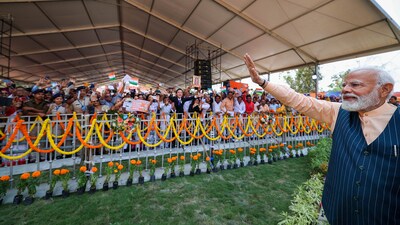 Prime Minister Narendra Modi waves at the gathering during foundation stone laying and inauguration of multiple connectivity projects, in Kolkata on Wednesday, (PTI) Prime Minister Narendra Modi waves at the gathering during foundation stone laying and inauguration of multiple connectivity projects, in Kolkata on Wednesday, (PTI)