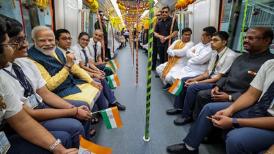 PM Modi also took a ride on a metro train from Esplanade to Howrah Maidan and interacted with school students during the journey passing through the tunnel. (PTI) PM Modi also took a ride on a metro train from Esplanade to Howrah Maidan and interacted with school students during the journey passing through the tunnel. (PTI)