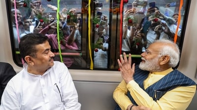PM Modi with BJP leader Suvendu Adhikari rides on a metro train during foundation stone laying and inauguration of multiple connectivity projects, in Kolkata. (PTI) PM Modi with BJP leader Suvendu Adhikari rides on a metro train during foundation stone laying and inauguration of multiple connectivity projects, in Kolkata. (PTI)