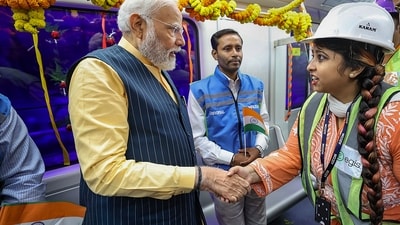 PM Modi returned to the Esplanade station through the same route and was accompanied by the Leader of the Opposition in the state Suvendu Adhikari during the trip. (PTI) PM Modi returned to the Esplanade station through the same route and was accompanied by the Leader of the Opposition in the state Suvendu Adhikari during the trip. (PTI)
